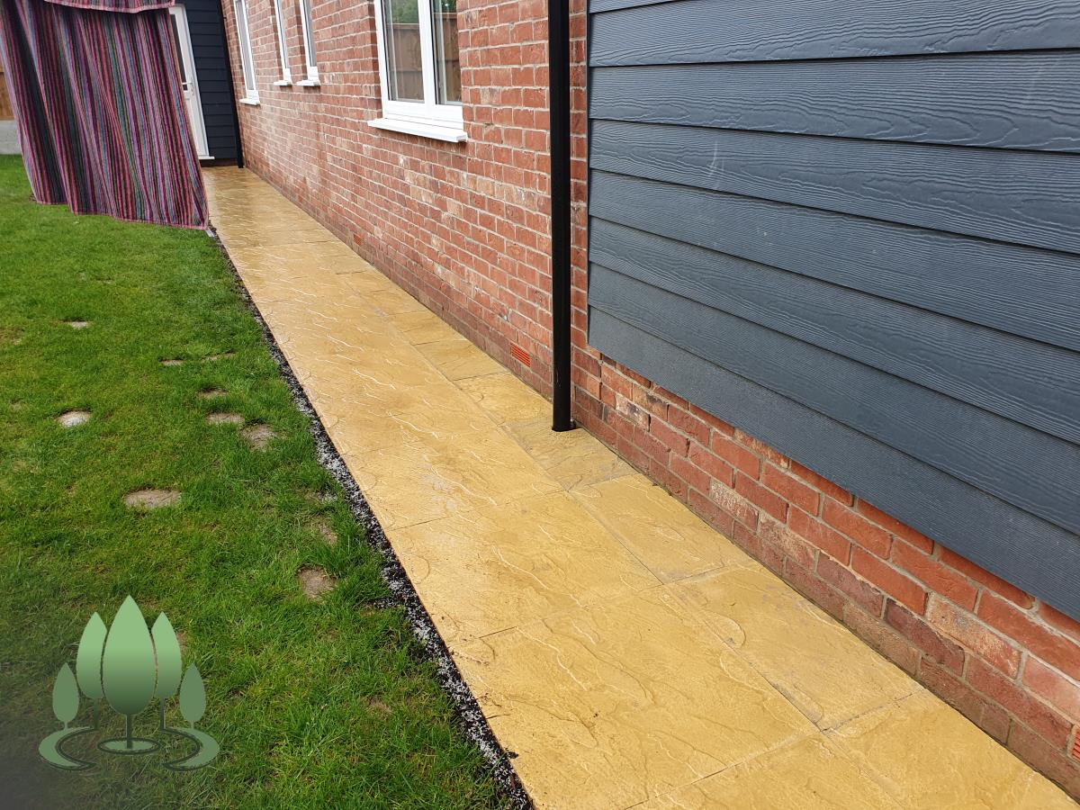 Installation of a new fence built from concrete posts, concrete gravel boards and close board feather edge fence panels.