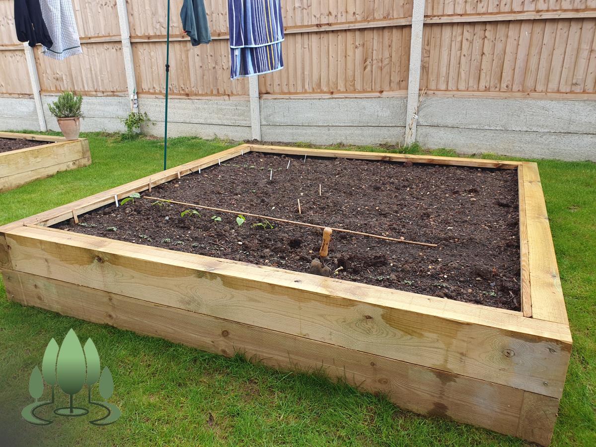 Installation of a new fence built from concrete posts, concrete gravel boards and close board feather edge fence panels.