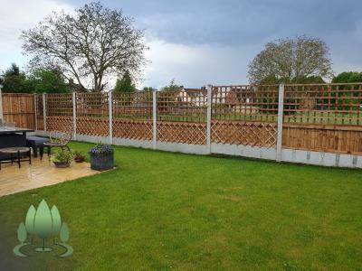 Installation of a new fence built from concrete posts, concrete gravel boards and close board feather edge fence panels.